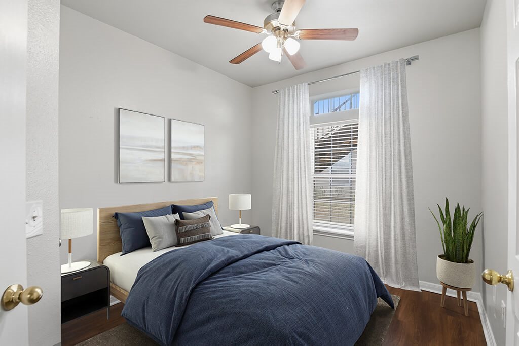 Bedroom with ceiling fan at Almeda Park Apartments in Houston TX
